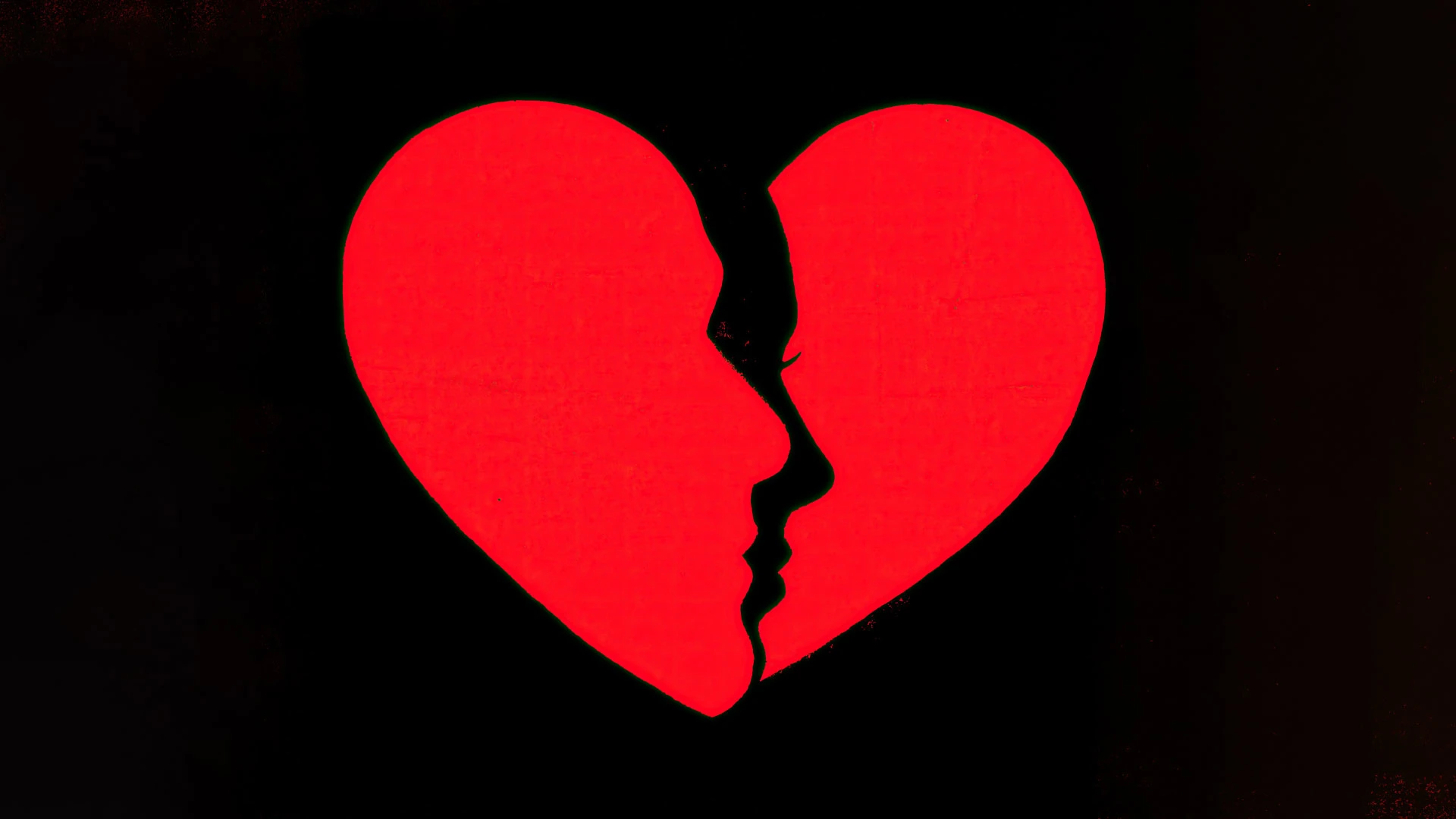 A red heart shape on a black background, with the silhouettes of two faces in profile forming the inner edge of the heart as if about to kiss or closely facing each other.